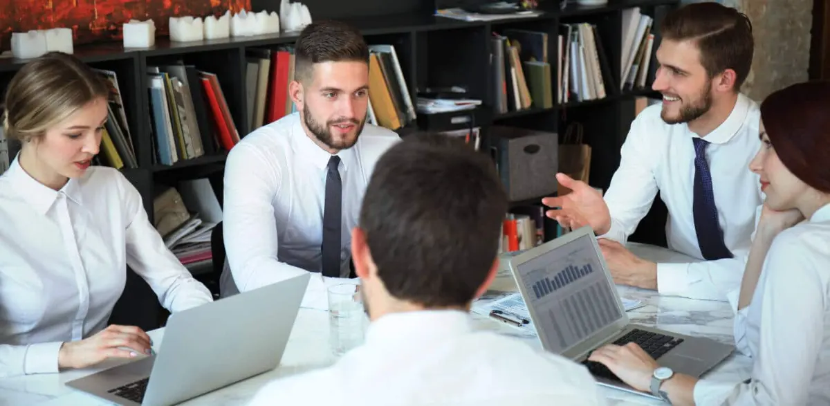 Colleagues in a business meeting around a table